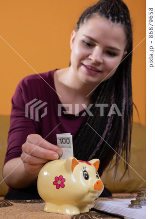 Reasonable planning and saving money are effective after the first year. A happy young teenager because she has learned to plan her expenses well. Reasonable planning and saving money are effective after the first year. A happy young teenager because she has learned to plan her expenses well. 86879658