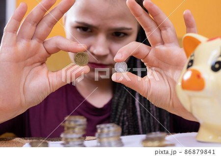 The teenager wonders how to spend the last money she has left after making all the necessary monthly payments for the apartment and all utilities. 86879841
