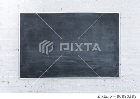 Chalkboard not well sponged. The simplest arithmetic problem in mathematics - adding two numbers together. White brick wall. Chalkboard not well sponged. The simplest arithmetic problem in mathematics - adding two numbers together. White brick wall. 86880285