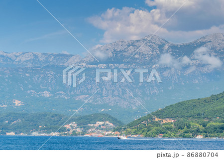 Scenic panoramic landscape view on Bay of Kotor, Montenegro with mountains at sundown. 86880704