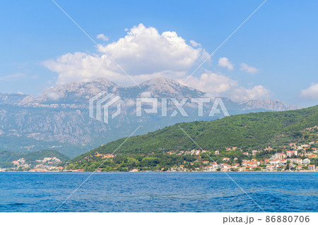 Scenic panoramic landscape view on Bay of Kotor, Montenegro with mountains at sundown. 86880706