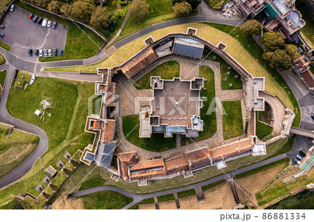 Aerial view of the Dover Castle. The most iconic of all English fortresses. English castle on top of the hill. Aerial view of the Dover Castle. The most iconic of all English fortresses. English castle on top of the hill. 86881334