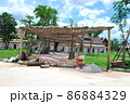 Wooden frame made of bamboo. Bamboo walkway arch. 86884329