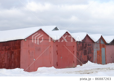 A number of private metal garages are covered with snow, Moscow region February 2022. 86887263