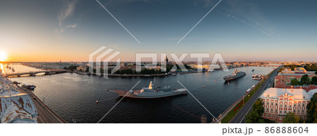 Aerial panoramic landscape of warships in the waters of the Neva River before the holiday of the Russian Navy, sea power, the latest cruisers among the sights, Isaac cathedral on a background Aerial panoramic landscape of warships in the waters of the Neva River before the holiday of the Russian Navy, sea power, the latest cruisers among the sights, Isaac cathedral on a background 86888604
