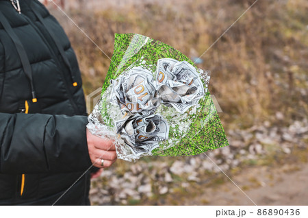 A woman is holding a bouquet of hundred-dollar bills. A woman is holding a bouquet of hundred-dollar bills. 86890436