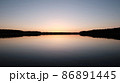 Water surface of the Lake and vegetation during sunset. 86891445