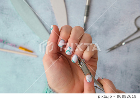 Professional stylish trendy blue Hardware Manicure. Procedure for the preparation of nails. Cuticle Pusher Remover. Nail file scissors Top view flat lay. Self care. Spa, beautician advertisement. Professional stylish trendy blue Hardware Manicure. Procedure for the preparation of nails. Cuticle Pusher Remover. Nail file scissors Top view flat lay. Self care. Spa, beautician advertisement. 86892619