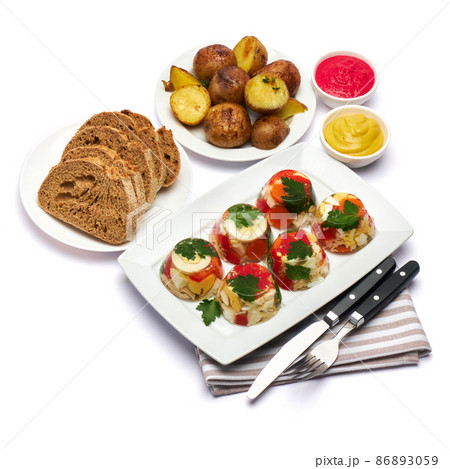 Portion of delicious chicken aspic on a plate isolated on white background 86893059