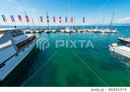 Panoramic view of Lake Garda from the Port of Bardolino Village - Veneto Italy 86895079