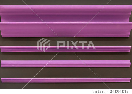 Purple pink ceiling skirting board material for repair and interior design of the corners of the ceiling of the house inside 86896817