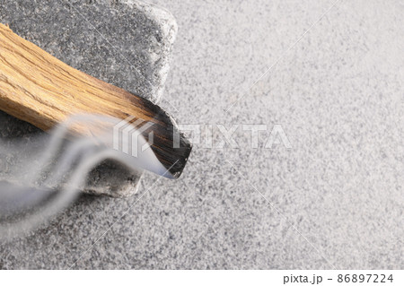 Palo Santo stick incense burning for aromatherapy. Palo Santo stick incense burning for aromatherapy. 86897224