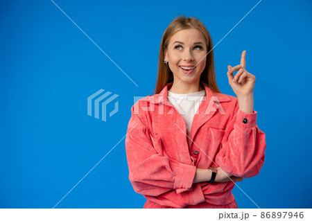 Thoughtful beautiful young woman deep thinking against blue background 86897946