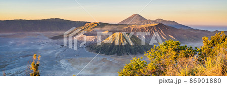 BANNER, LONG FORMAT Sunrise at the Bromo Tengger Semeru National Park on the Java Island, Indonesia. View on the Bromo or Gunung Bromo on Indonesian, Semeru and other volcanoes located inside of the 86901880