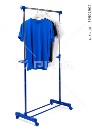 Clothes hang on clothing rack over white background. 86901906