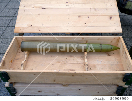 Large bullet in a wooden box Large bullet in a wooden box 86903990