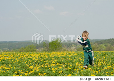 Boy and dandelion Boy and dandelion 86904481