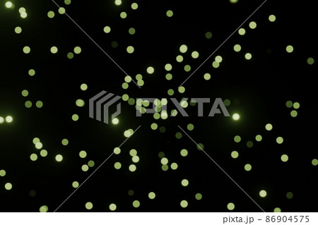 Defocused bokeh lights on black background, an abstract naturally blurred backdrop for Valentines Day or birthday party. Festive light texture. Green blue garland in blur 86904575
