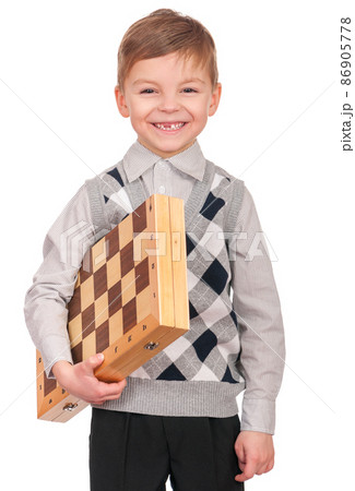 Little boy with chessboard Little boy with chessboard 86905778