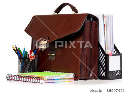 Brown leather briefcase with office accessories 86907491