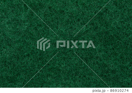 Texture of a abrasive scourer dishwashing sponge. Background of a scrub sponge close up. Texture of a abrasive scourer dishwashing sponge. Background of a scrub sponge close up. 86910274