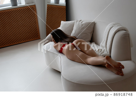 Sensual woman in underwear lying on sofa 86918748