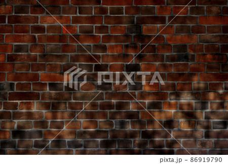 レンガ背景。影で黒くなった部分に文字が配置しやすいレンガ壁の素材。 86919790