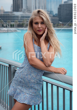Young woman enjoying view of Dubai downtown. Young woman enjoying view of Dubai downtown. 86922069