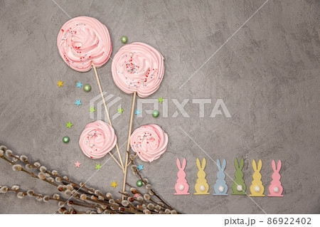 Whipped egg cream cookies . Easter composition with rabbits. 86922402