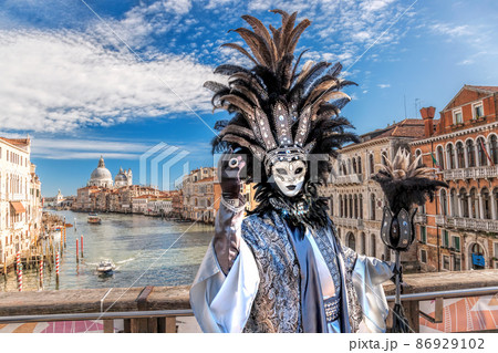 Colorful carnival masks at a traditional festival in Venice, Italy 86929102