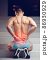 Injured spine. Young handsome muscular athlete having spine pain 86930929