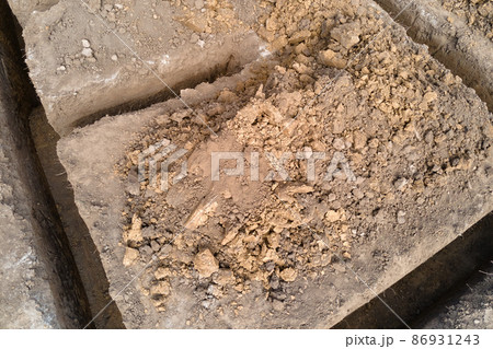 Dug out trench for building works of new house concrete foundation on construction site Dug out trench for building works of new house concrete foundation on construction site 86931243