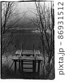 A broken small wooden pier on a forest lake. 86931512