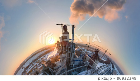 Aerial view from high altitude of little planet earth with cement factory tower with high concrete plant structure at industrial production area at sunset. Manufacturing and global industry concept 86932349