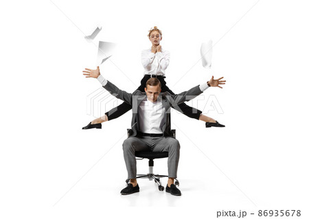 Two stylish office workers in business suits in action isolated on white background. Art, beauty, fashion and business concept 86935678