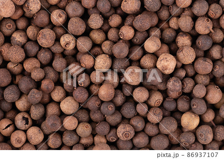 Allspice background. Jamaican pepper, pimento berry, allspice peppercorns or myrtle pepper. Allspice background. Jamaican pepper, pimento berry, allspice peppercorns or myrtle pepper. 86937107