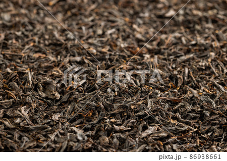 full frame background of flat heap of dry long-term black tea 86938661
