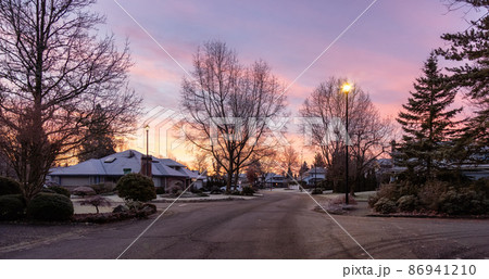 View of Residential Suburban Neighborhood Street in a modern city View of Residential Suburban Neighborhood Street in a modern city 86941210