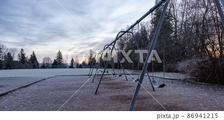 Empty playground during a frosty winter morning. Empty playground during a frosty winter morning. 86941215