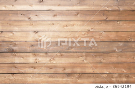 木目や節のある薄茶色の板が並ぶ横長の背景画像 86942194
