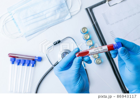 Omicron mutation coronavirus variant. Medical laboratory doctor holding test tube in hospital laboratory. Pandemic prevention. Clinical research. Omicron mutation coronavirus variant. Medical laboratory doctor holding test tube in hospital laboratory. Pandemic prevention. Clinical research. 86943117