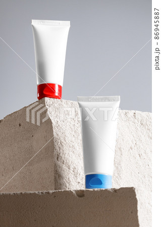 Skincare cosmetic jar on gray cinder block Skincare cosmetic jar on gray cinder block 86945887
