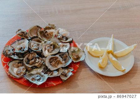 Fresh oysters with lime. Luxury Seafood On The Plate. 86947027