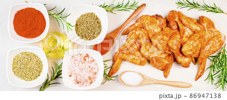 Chicken wings are raw in the marinade. Oven baking wings. Semifinished. Fast cooking.Raw Marinated chicken meat wings for BBQ,Cooking chicken with spices . Grilled chicken wings recipe. Chicken wings are raw in the marinade. Oven baking wings. Semifinished. Fast cooking.Raw Marinated chicken meat wings for BBQ,Cooking chicken with spices . Grilled chicken wings recipe. 86947138