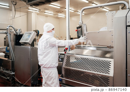 Automated production line with packaging and cutting of meat in modern food factory.Meat processing equipment. 86947140