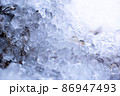 Frozen water drops in winter. 86947493
