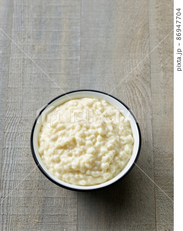 bowl of fresh rice milk pudding 86947704