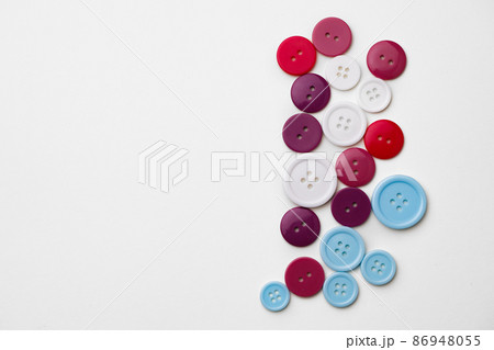 Assortment of colorful buttons on white background Assortment of colorful buttons on white background 86948055