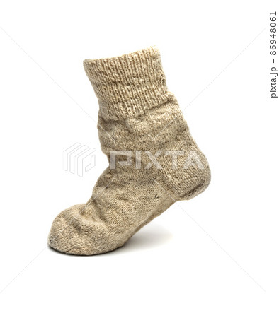 warm sock made of natural sheep wool on a white background warm sock made of natural sheep wool on a white background 86948061