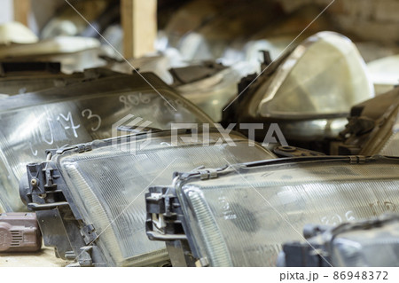 Used headlamp components for sale on the store shelf. Used headlamp components for sale on the store shelf. 86948372